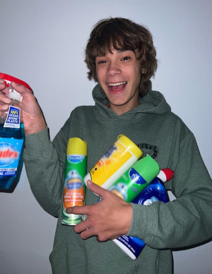  Boyd Czaikowski holding common household cleaning products that he may use during his services.