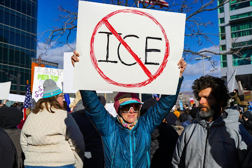 Photo by Yasmin Peyman on Unsplash, photo of an anti-ICE rally.