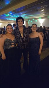 This is a picture of me and one of my friends with the one and only Elvis Presley.