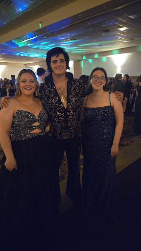 This is a picture of me and one of my friends with the one and only Elvis Presley.