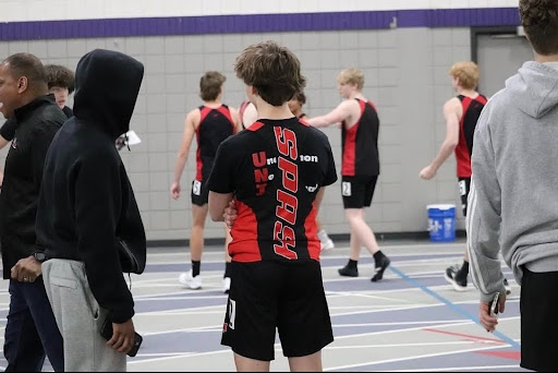 This image was taken at the UWSP. The Stevens Point Area Senior High boys 60 meter dash getting ready to sprint. Captured by the spashsportnation.
